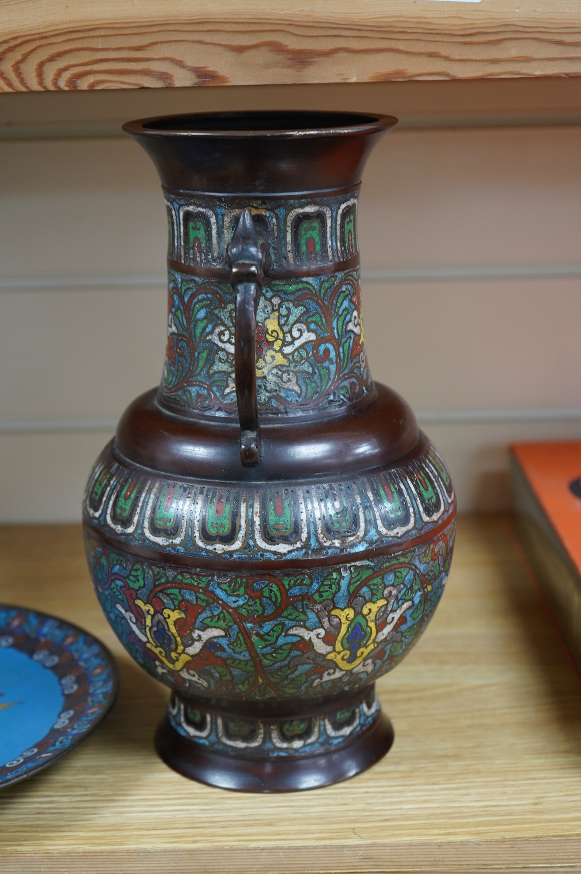 A Japanese archaistic bronze and champlevé enamel cloisonné two handled vase together with a Japanese cloisonné enamel dish, depicting a bird amongst flowers, 30cm high
